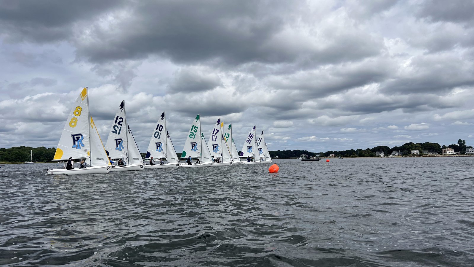 URI sailing fleet racing under a dramatic sky