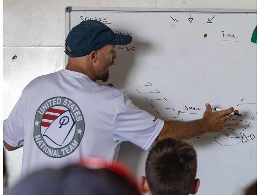 Manny Resano briefing sailors at the whiteboard